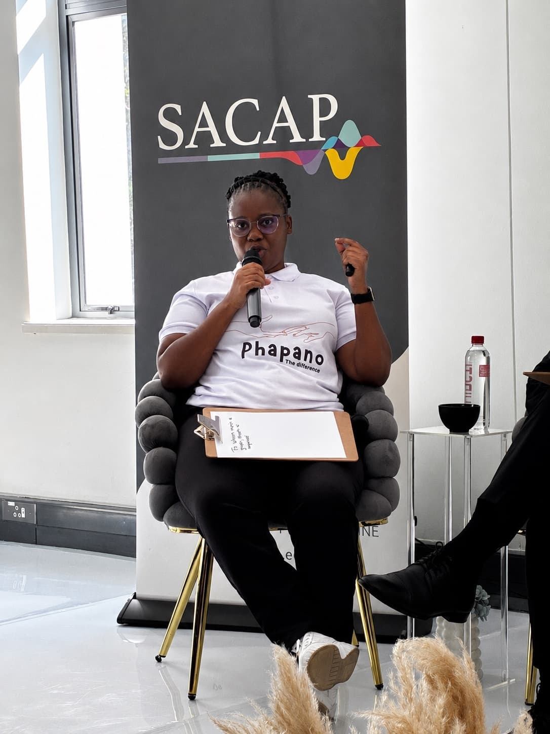 Nqobile Mnisi participating in a panel discussion at SACAP