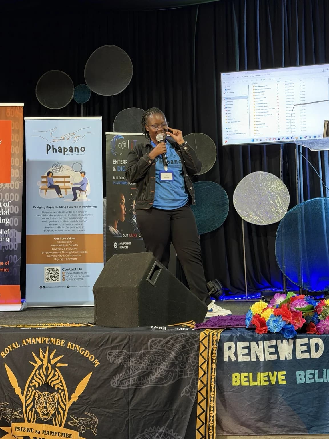 Nqobile Mnisi speaking on stage at a public engagement
